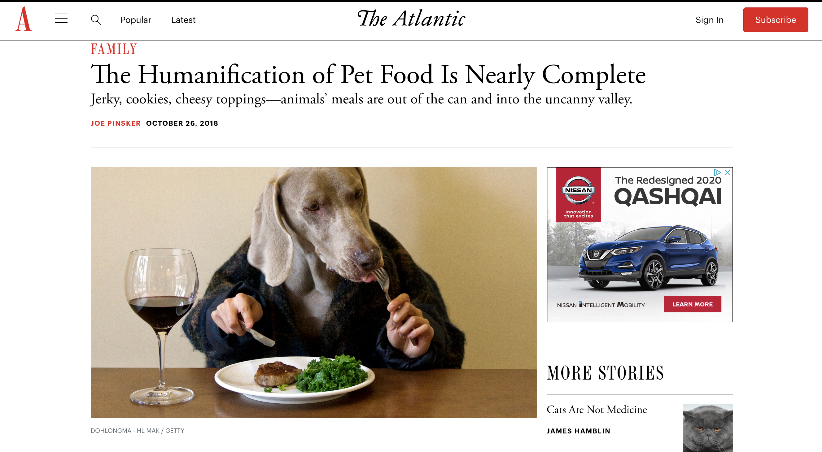 Atlantic e-zine article titled The Humanification of Pet Food Is Nearly Complete, featuring a human with a dog's head, eating food with a fork