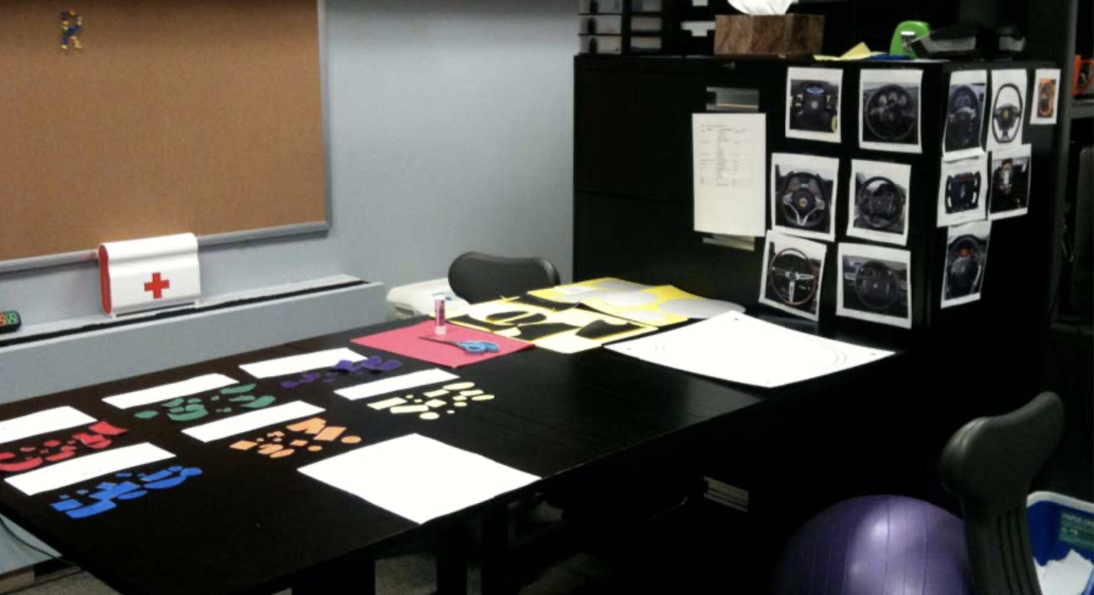 a desk with arts and craft items on it for a design workshop