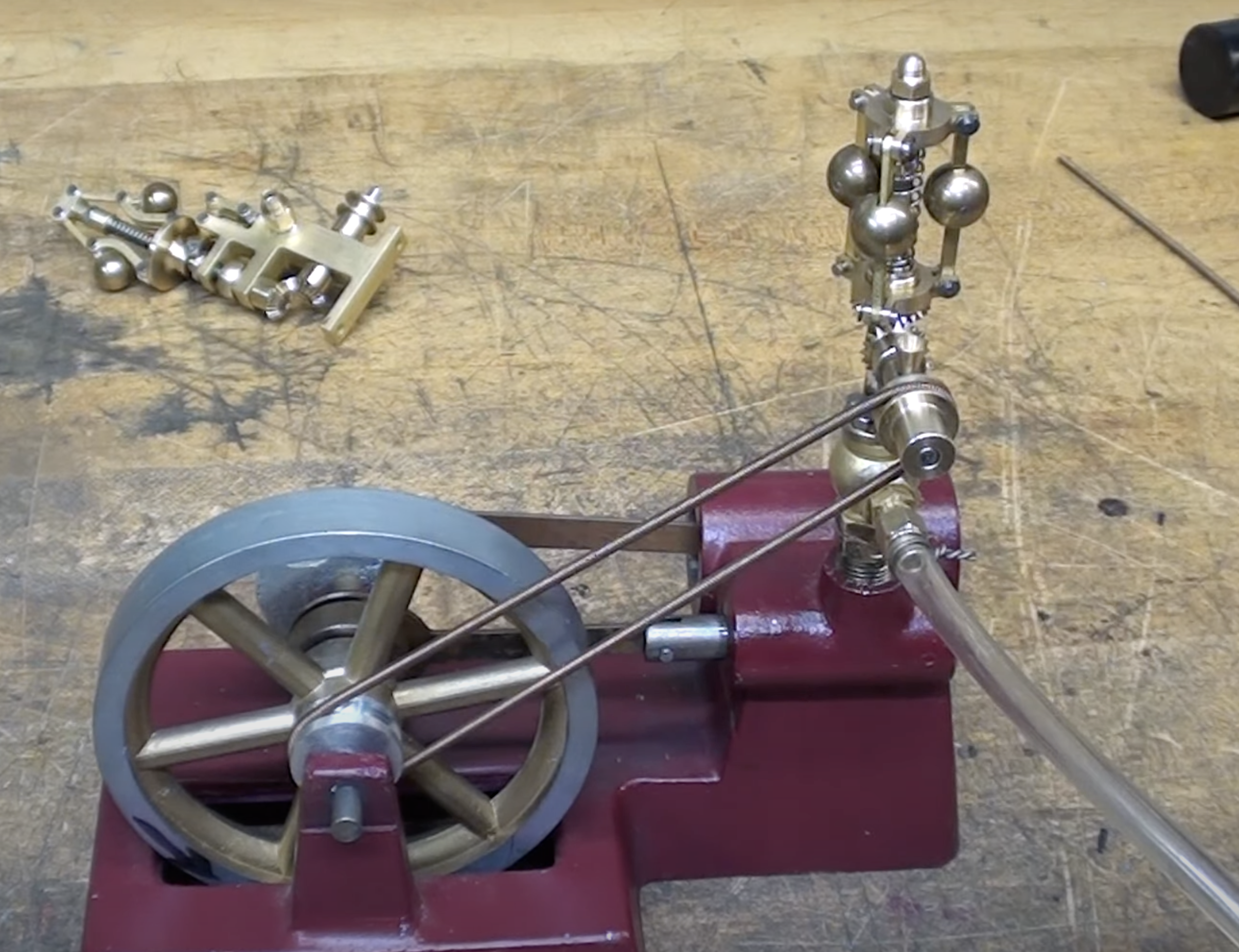 a steam engine showing the centrifugal governor